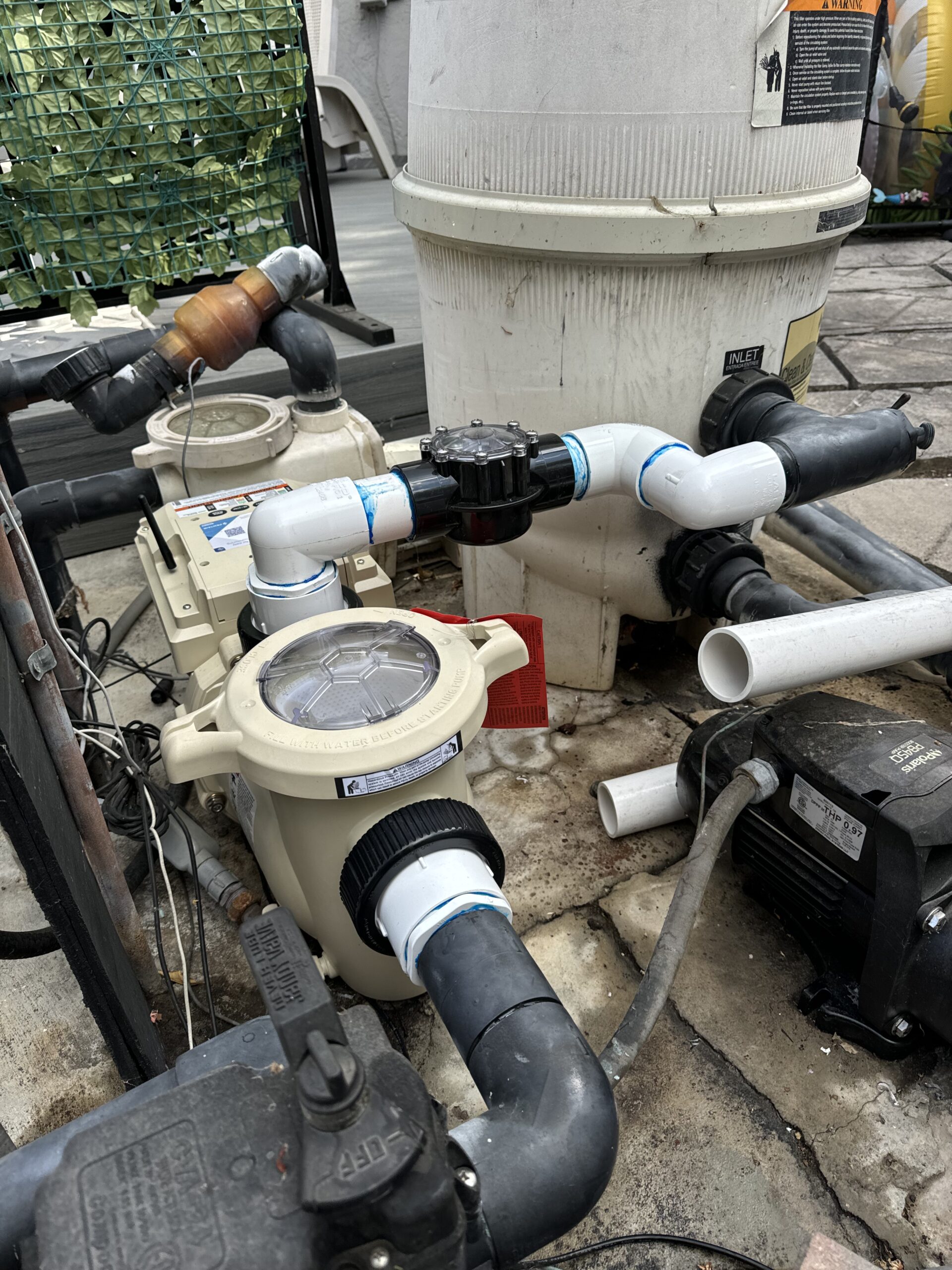 Pool pump, filter and plumbing on a residential equipment pad
