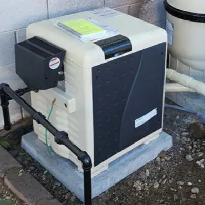 Pentair MasterTemp pool heater on an equipment pad