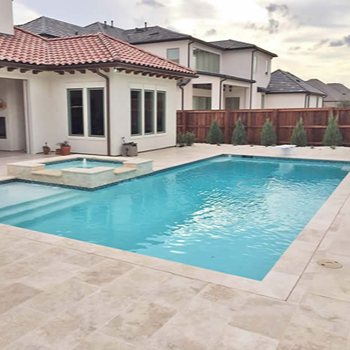 Light Walnut Travertine pool coping for a pool remodel