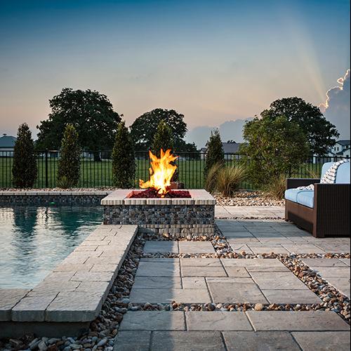 Outdoor fireplace for a pool amenity space