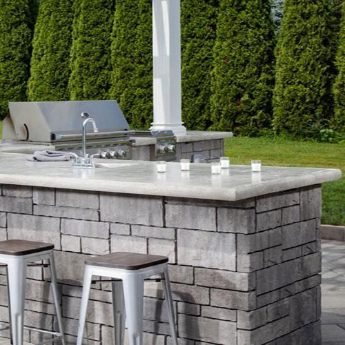 Outdoor kitchen next to a commercial pool area