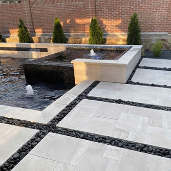 Platinum Ice Travertine pool coping in North Texas