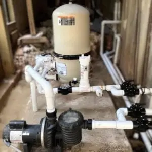 Cartridge filter and pool pump on a side-yard equipment pad
